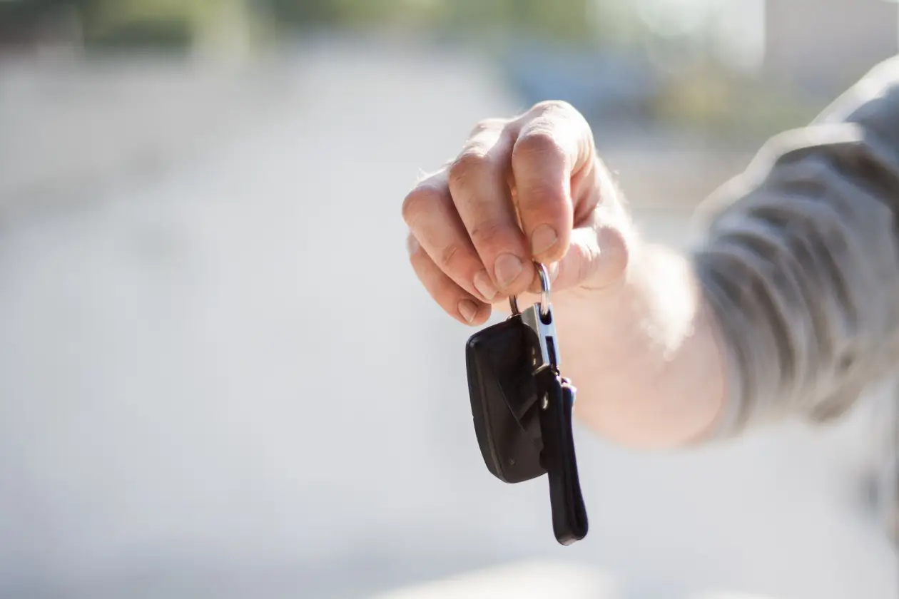 Economy Cars Albania team providing professional car rental services at Tirana Airport.